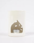 Brûle-parfum cylindrique en céramique blanche, diffuseur d'huiles essentielles, design épuré et élégant, idéal pour créer une ambiance apaisante dans votre intérieur.